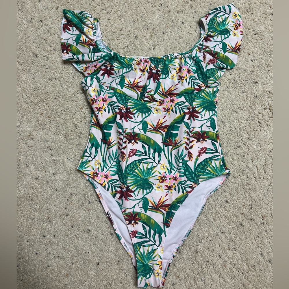 Size large one piece bathing suit off the shoulder. Pet/smoke free home